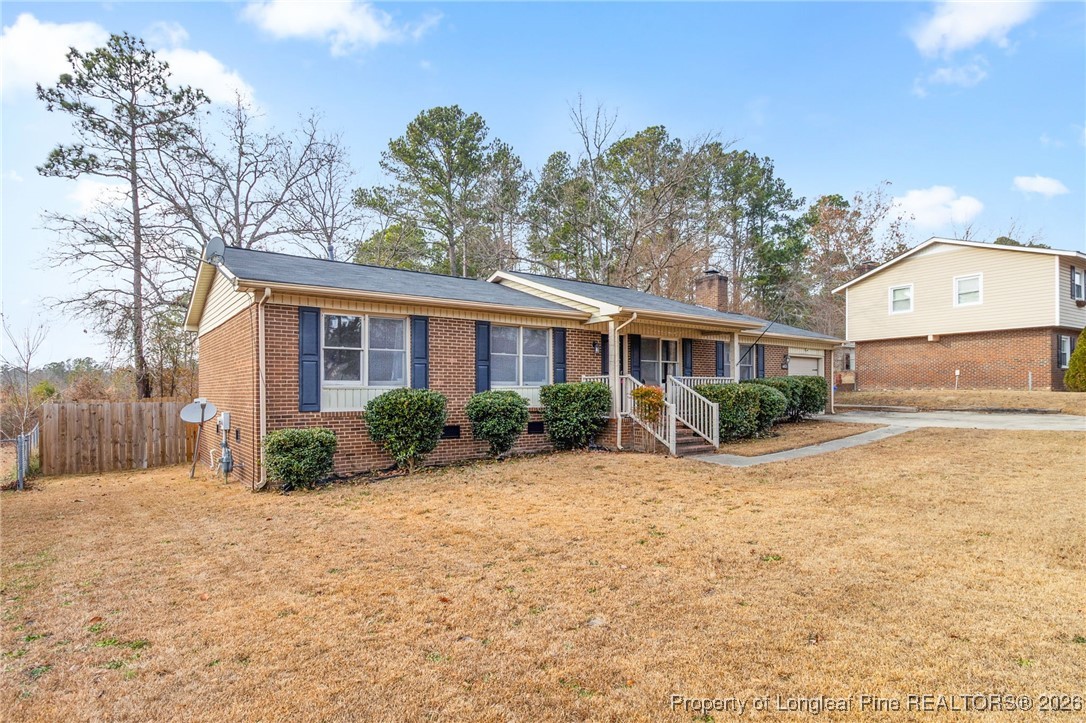 6654 Vaughn Road Fayetteville, NC 28304 - Photo 2 of 36 a front view of a house with a yard