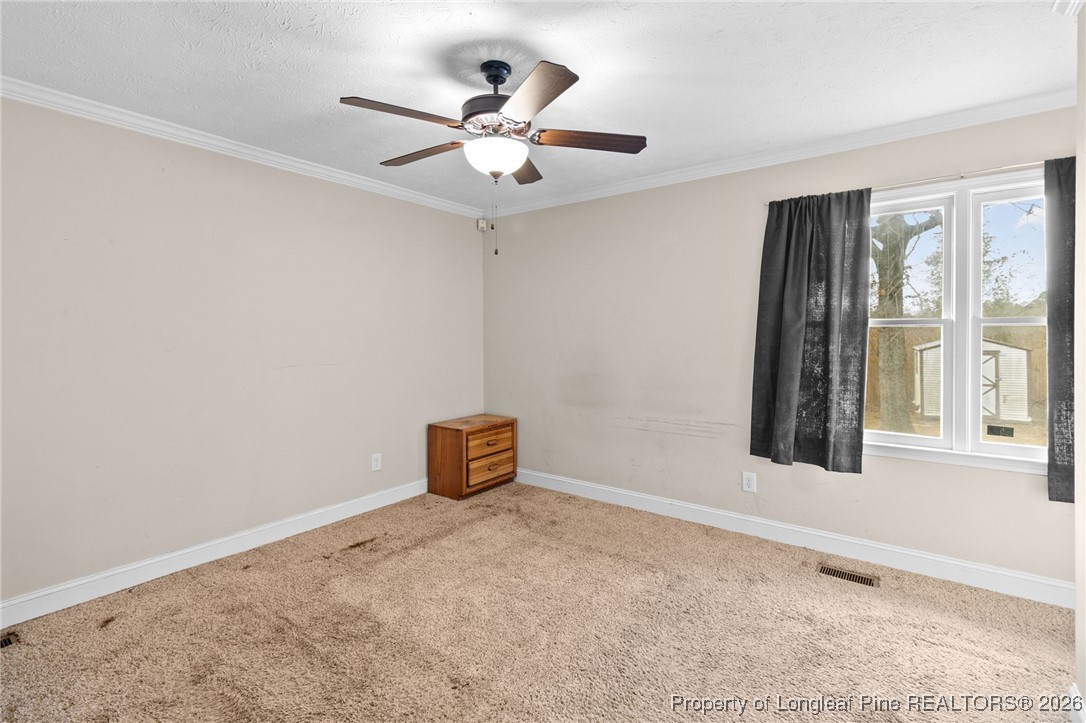 6654 Vaughn Road Fayetteville, NC 28304 - Photo 21 of 36 a view of an empty room with a window