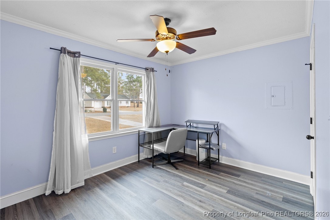 6654 Vaughn Road Fayetteville, NC 28304 - Photo 26 of 36 a work room with wooden floor and windows