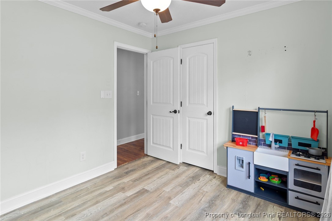 6654 Vaughn Road Fayetteville, NC 28304 - Photo 27 of 36 a view of room with wooden floor and flat screen tv