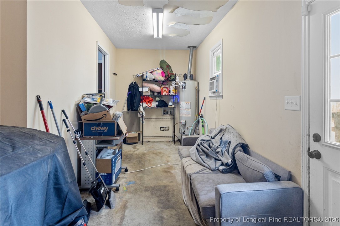 6654 Vaughn Road Fayetteville, NC 28304 - Photo 29 of 36 a view of a livingroom with furniture and a ceiling fan