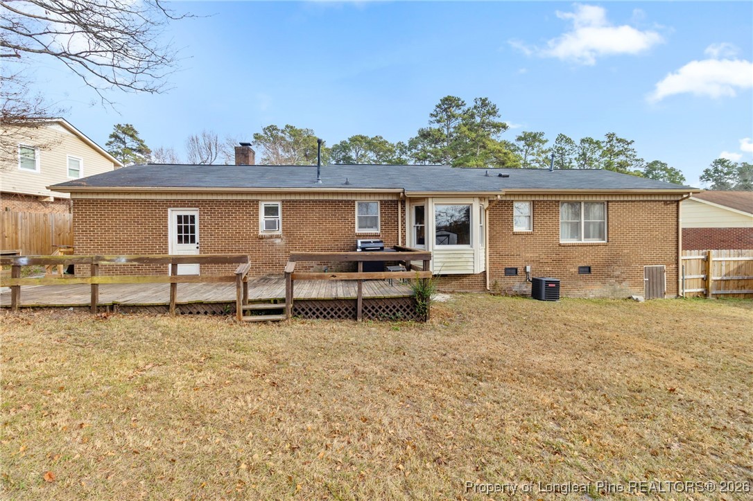 6654 Vaughn Road Fayetteville, NC 28304 - Photo 31 of 36 a backyard of a house with table and chairs