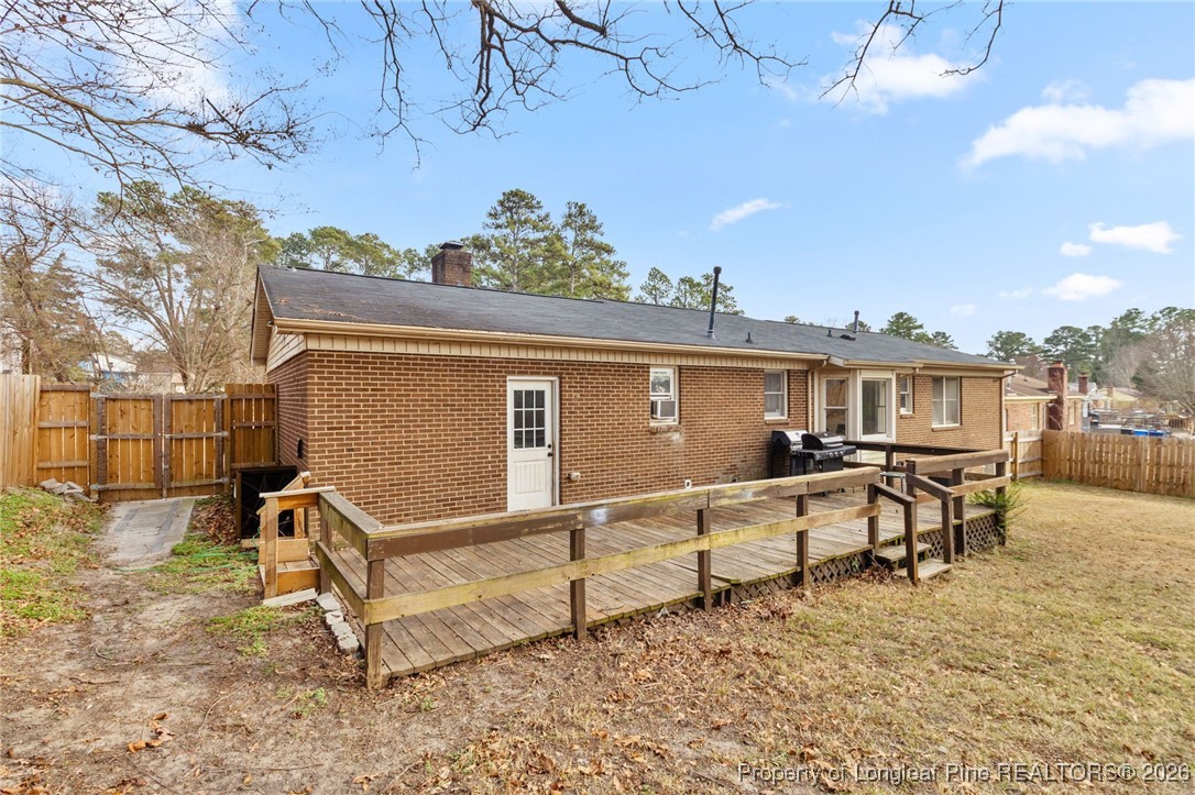 6654 Vaughn Road Fayetteville, NC 28304 - Photo 32 of 36 a view of a house with backyard and sitting area