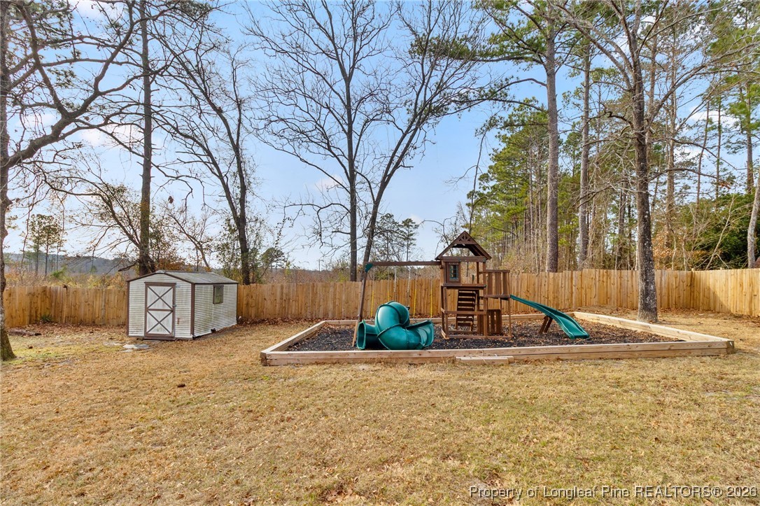 6654 Vaughn Road Fayetteville, NC 28304 - Photo 34 of 36 a view of road with large trees