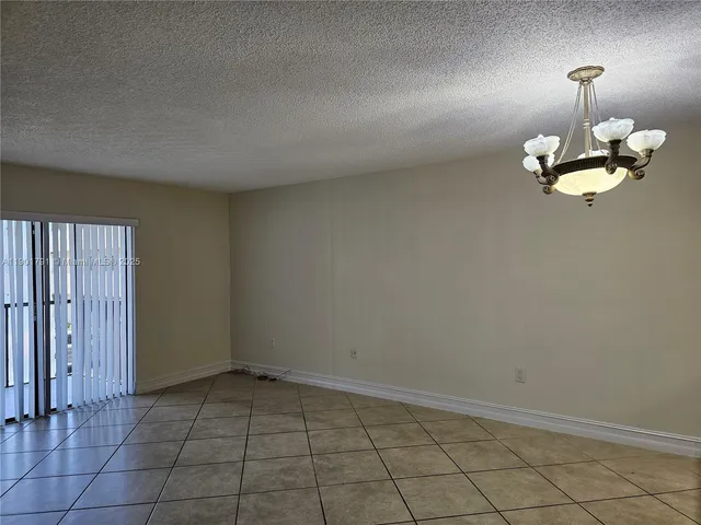 an empty room with a lamp