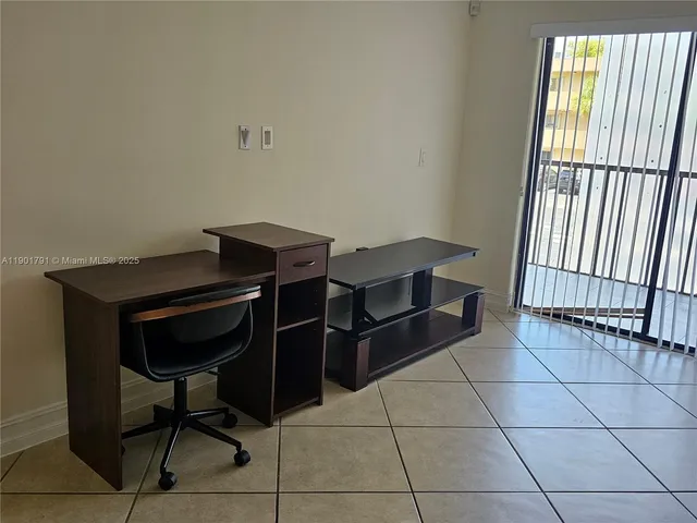 a view of workspace with furniture and window