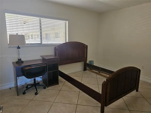 a room with a chair and a window