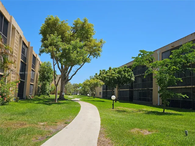 a view of pool with yard