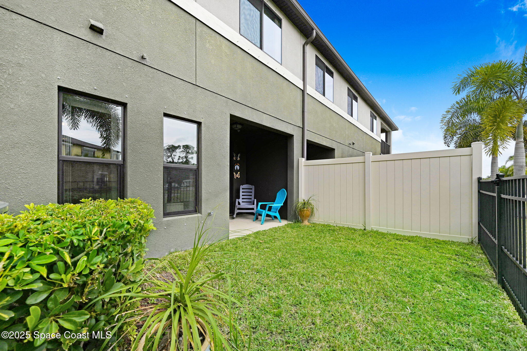 1430 Lara Circle, Unit 103 Rockledge, FL 32955 - Photo 21 of 39 a view of a house with backyard and a tree