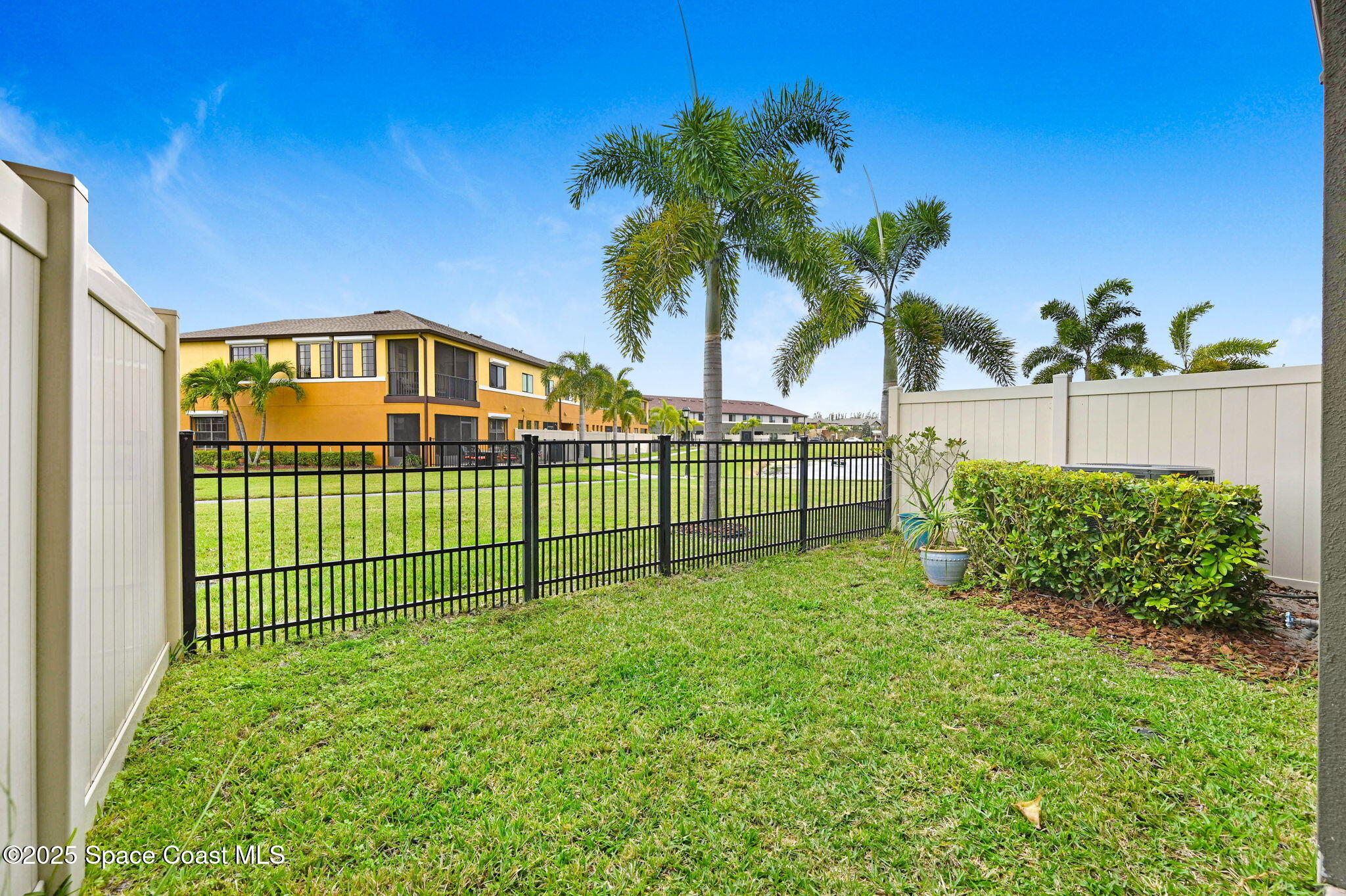 1430 Lara Circle, Unit 103 Rockledge, FL 32955 - Photo 22 of 39 a view of a garden with a small yard