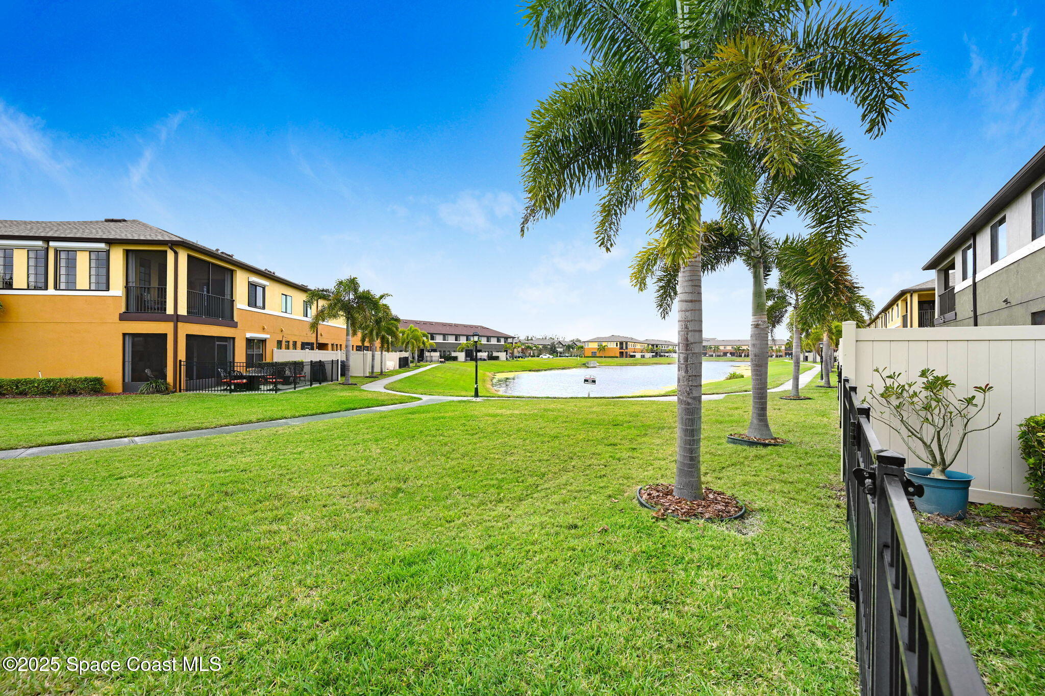 1430 Lara Circle, Unit 103 Rockledge, FL 32955 - Photo 23 of 39 a front view of a house with garden