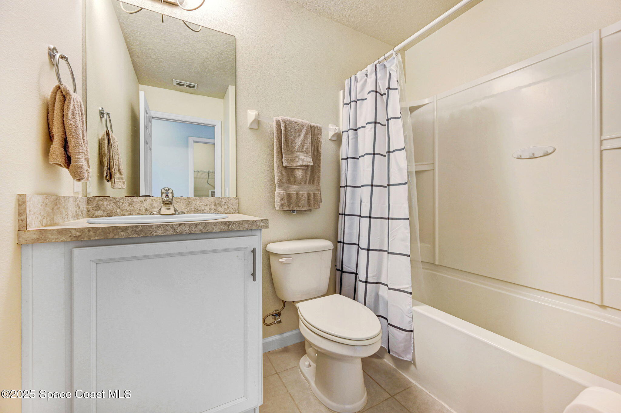 1430 Lara Circle, Unit 103 Rockledge, FL 32955 - Photo 30 of 39 a bathroom with a sink a toilet and shower