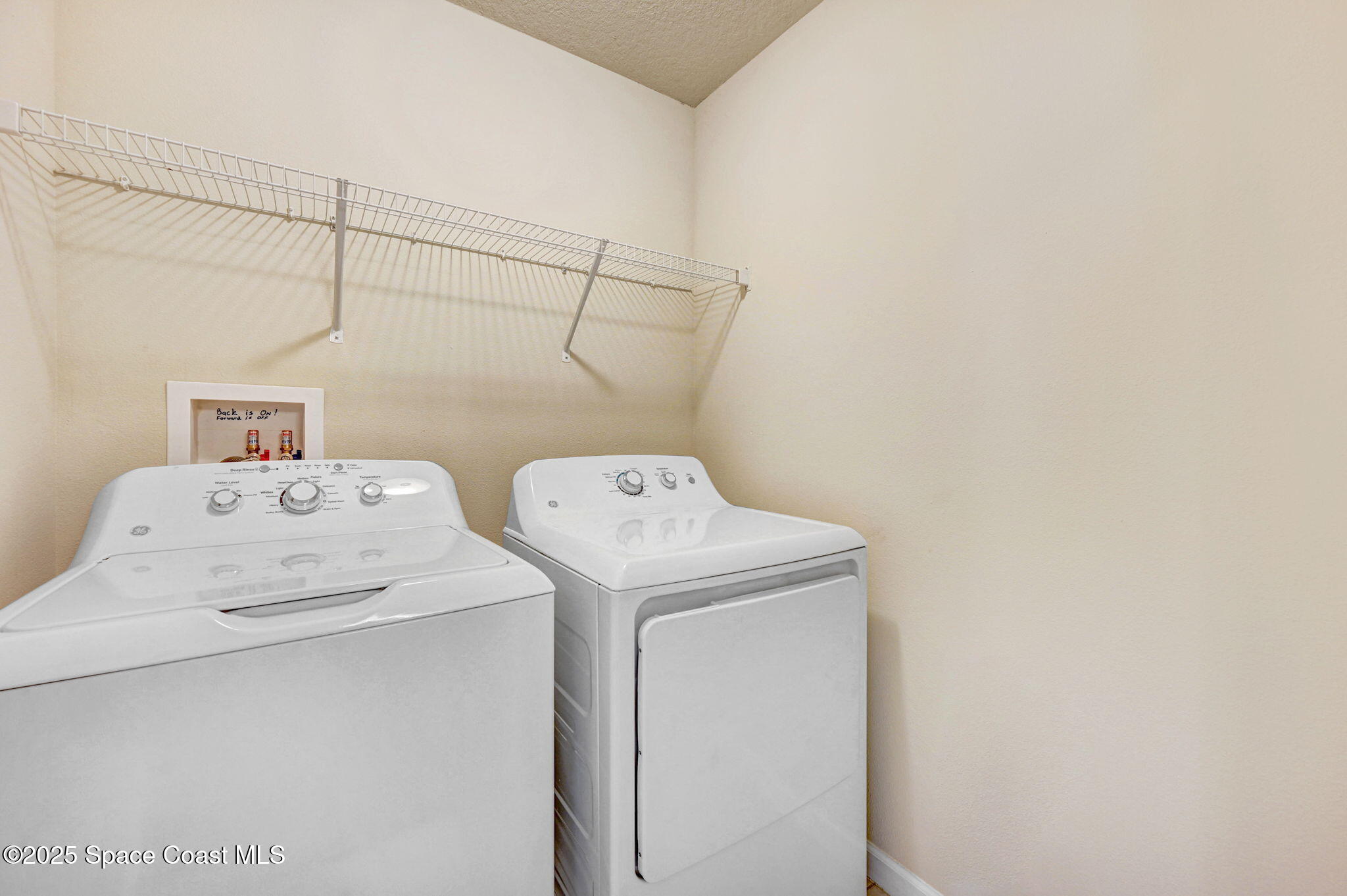 1430 Lara Circle, Unit 103 Rockledge, FL 32955 - Photo 32 of 39 a utility room with dryer and washer