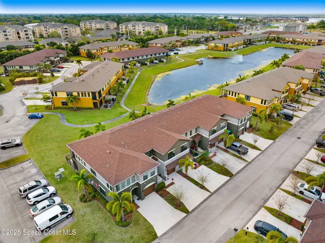 an aerial view of a house with a swimming pool yard and outdoor seating