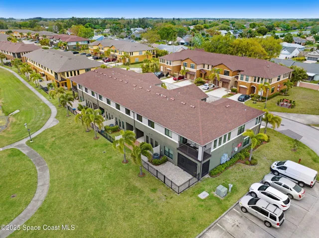 an aerial view of a house with a garden