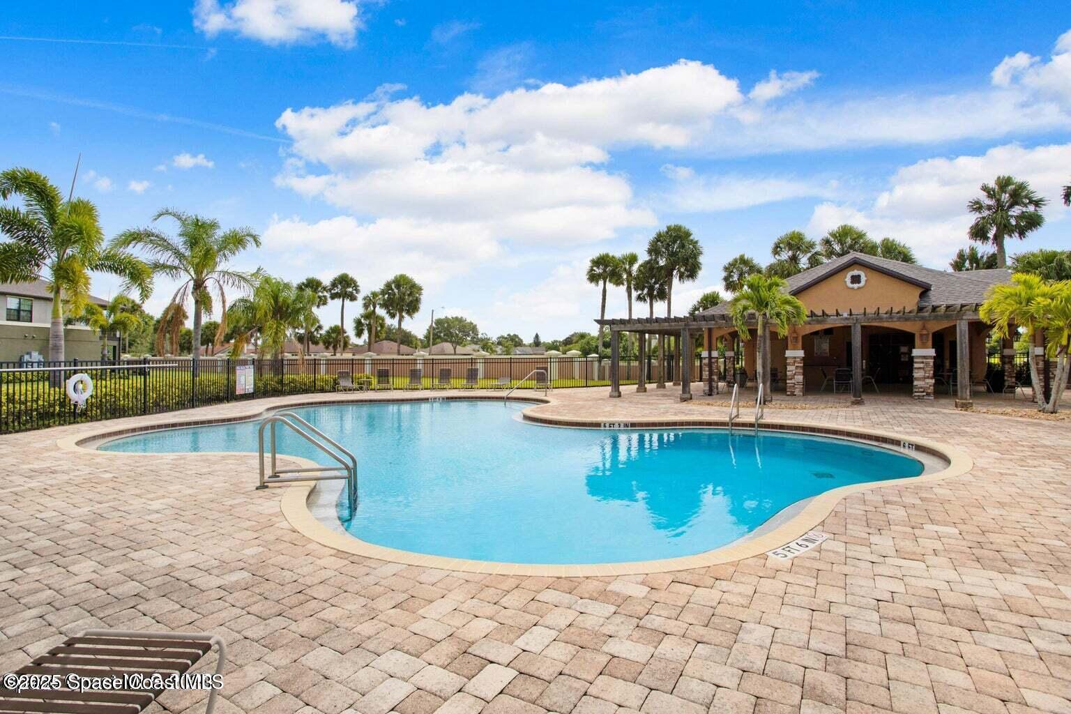 1430 Lara Circle, Unit 103 Rockledge, FL 32955 - Photo 39 of 39 a view of a swimming pool with an outdoor seating