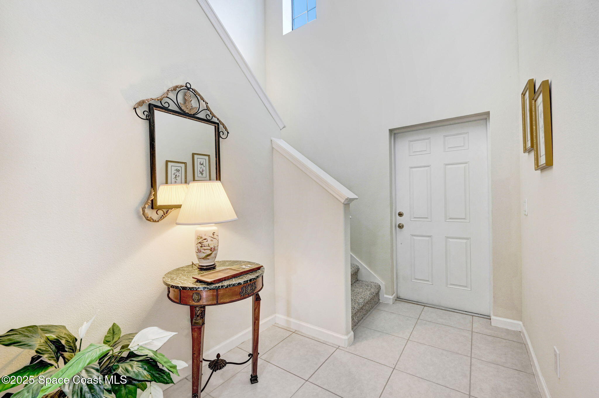 1430 Lara Circle, Unit 103 Rockledge, FL 32955 - Photo 5 of 39 a view of entryway and hall with wooden floor