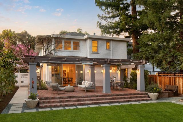 a view of a house with backyard porch and sitting area