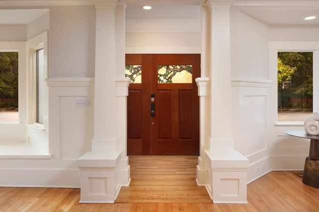 a view of front door of house and stairs