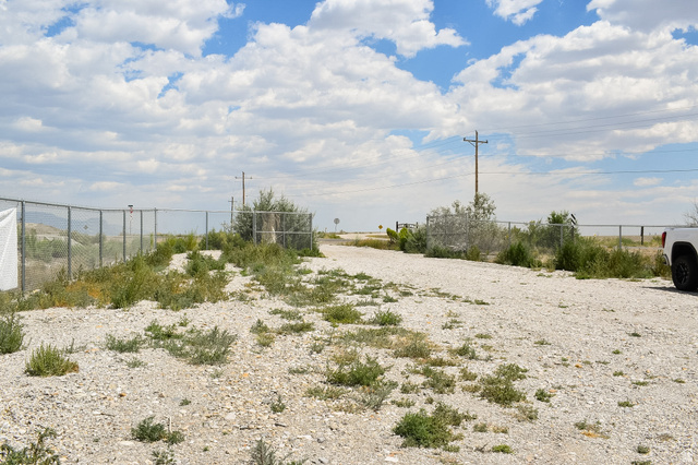 345 North Main Street Clawson, UT 84516 - Photo 10 of 17 Gravel access road featuring chain link fencing and established vegetation