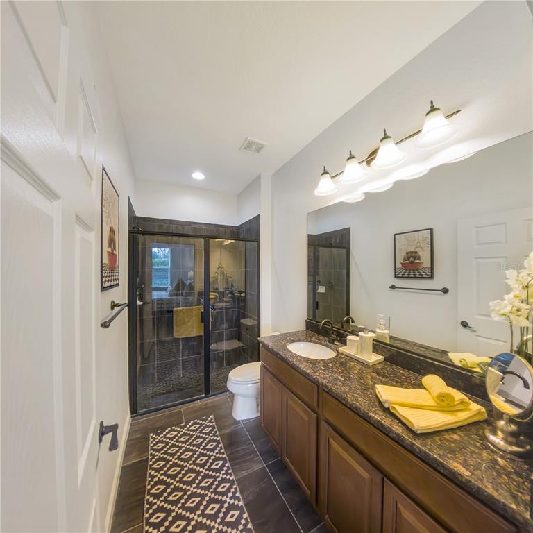 7235 Southwest 91st Court Ocala, FL 34481 - Photo 17 of 23 a bathroom with a sink and a shower