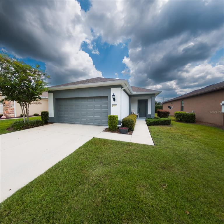 7235 Southwest 91st Court Ocala, FL 34481 - Photo 22 of 23 a front view of house with yard and entertaining space