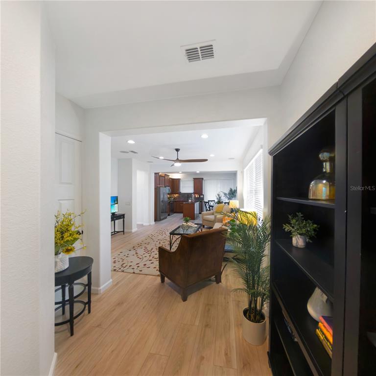 7235 Southwest 91st Court Ocala, FL 34481 - Photo 5 of 23 a living room with furniture and a wooden floor