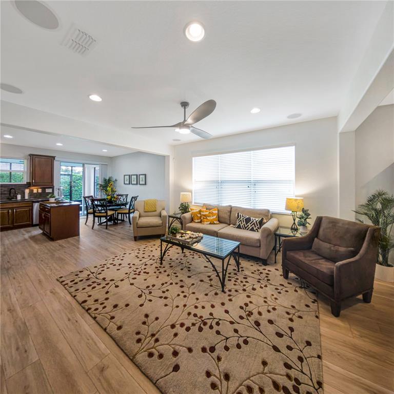 7235 Southwest 91st Court Ocala, FL 34481 - Photo 8 of 23 a living room with lots of furniture and a rug