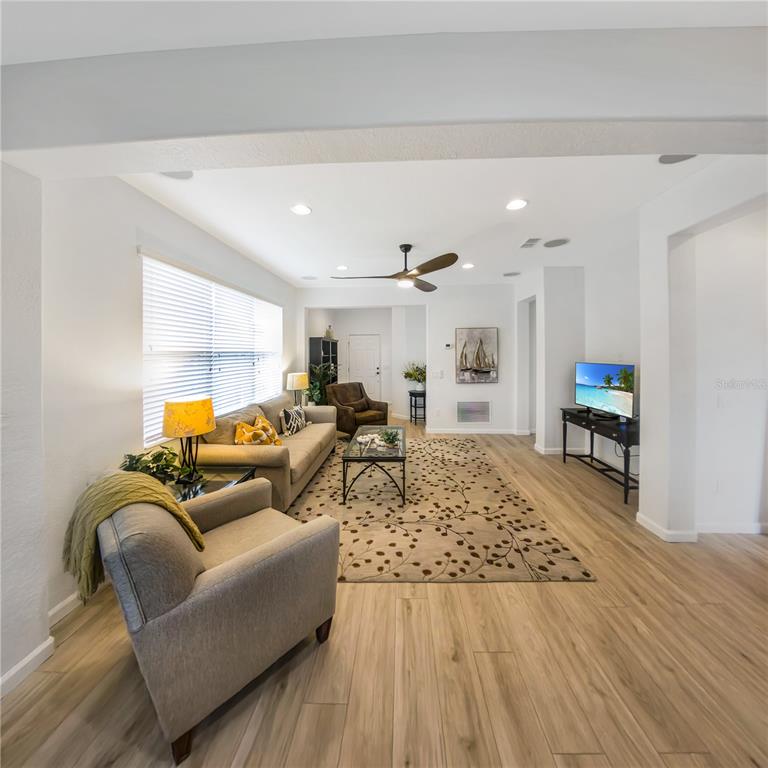 7235 Southwest 91st Court Ocala, FL 34481 - Photo 9 of 23 a living room with furniture and a wooden floor