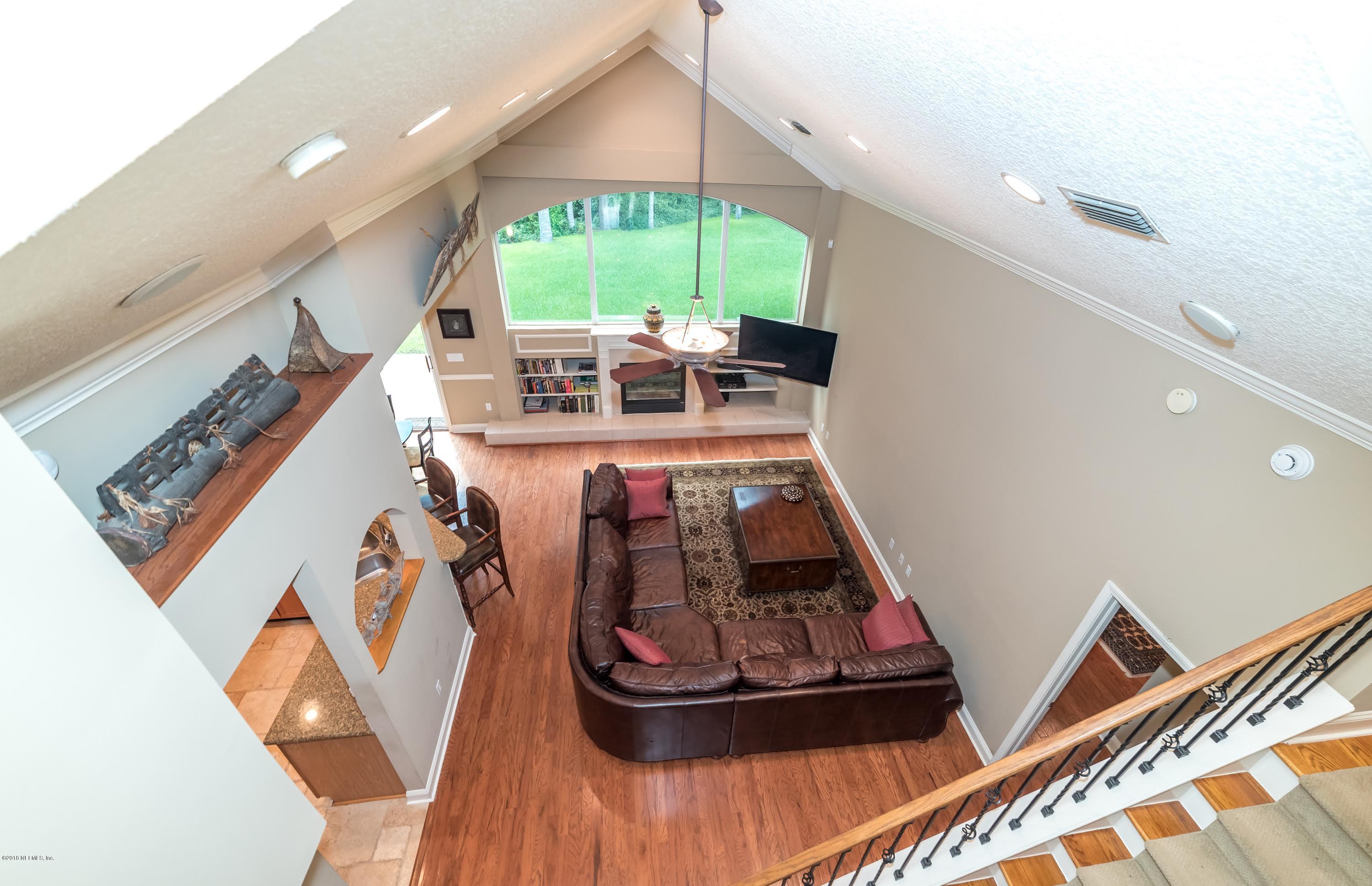 8964 Timberjack Lane Jacksonville, FL 32256 - Photo 12 of 23 a room with furniture and a wooden floor