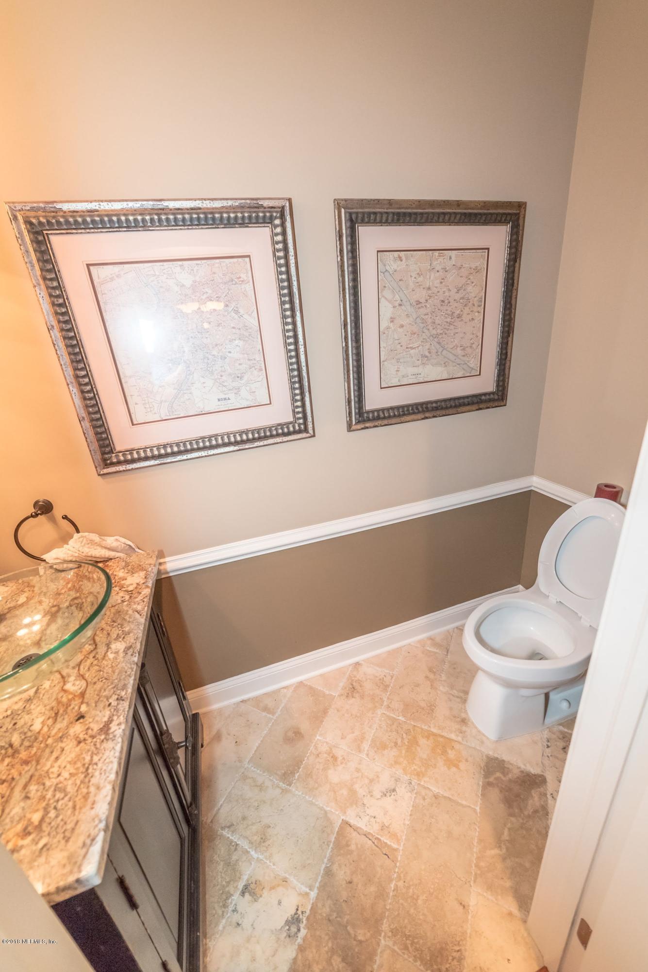 8964 Timberjack Lane Jacksonville, FL 32256 - Photo 20 of 23 a bathroom with a toilet a sink and bathtub