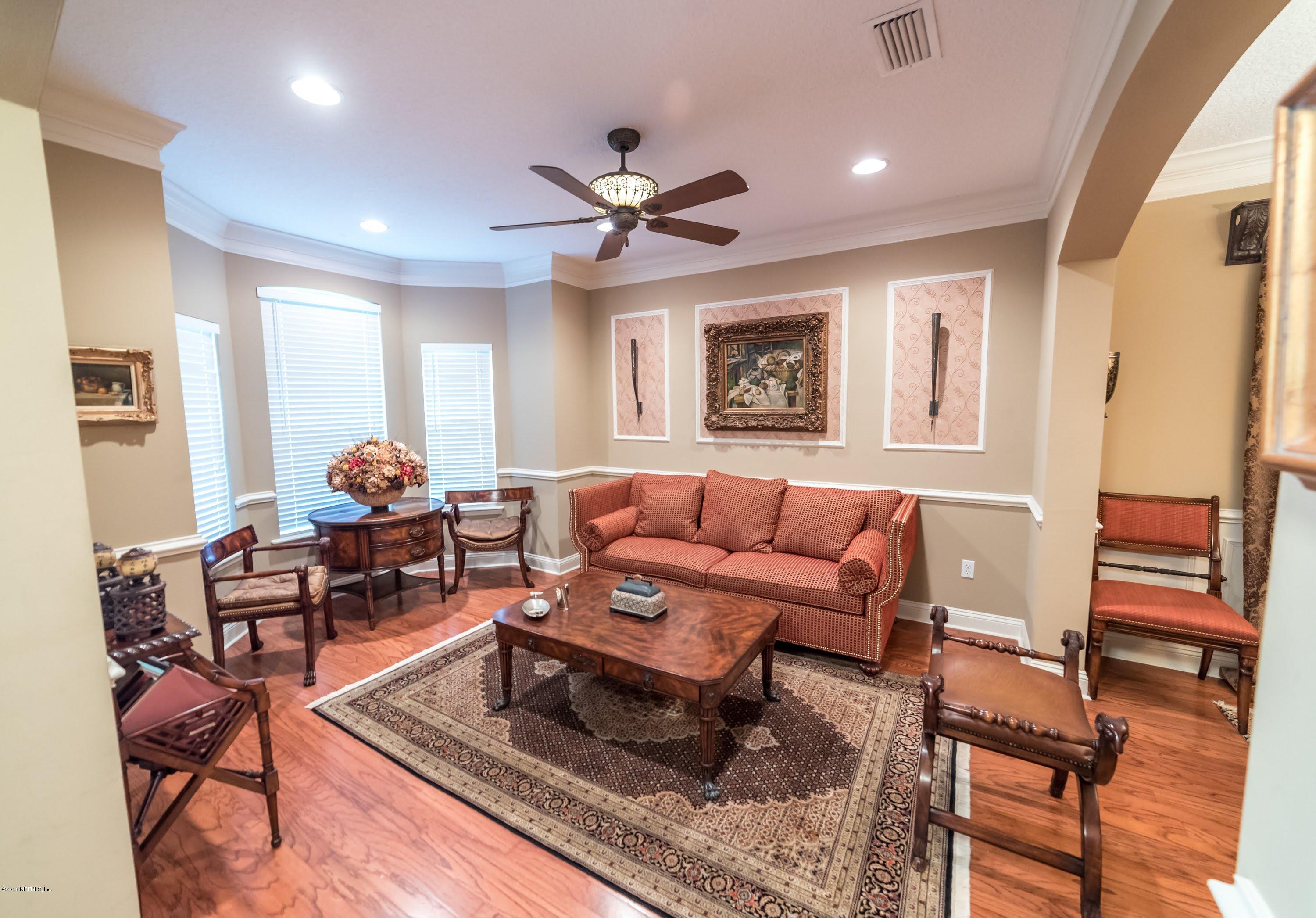 8964 Timberjack Lane Jacksonville, FL 32256 - Photo 5 of 23 a living room with furniture and a window