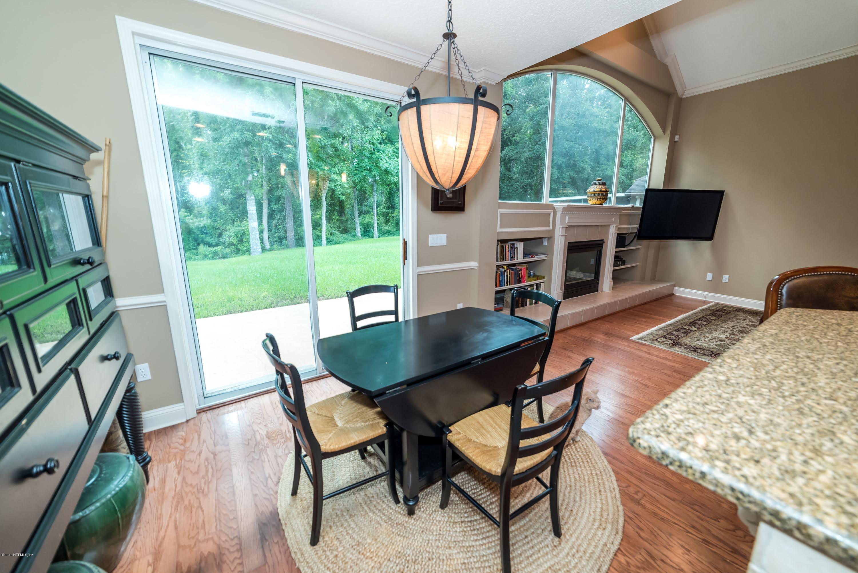 8964 Timberjack Lane Jacksonville, FL 32256 - Photo 9 of 23 a view of a dining room with furniture window and wooden floor