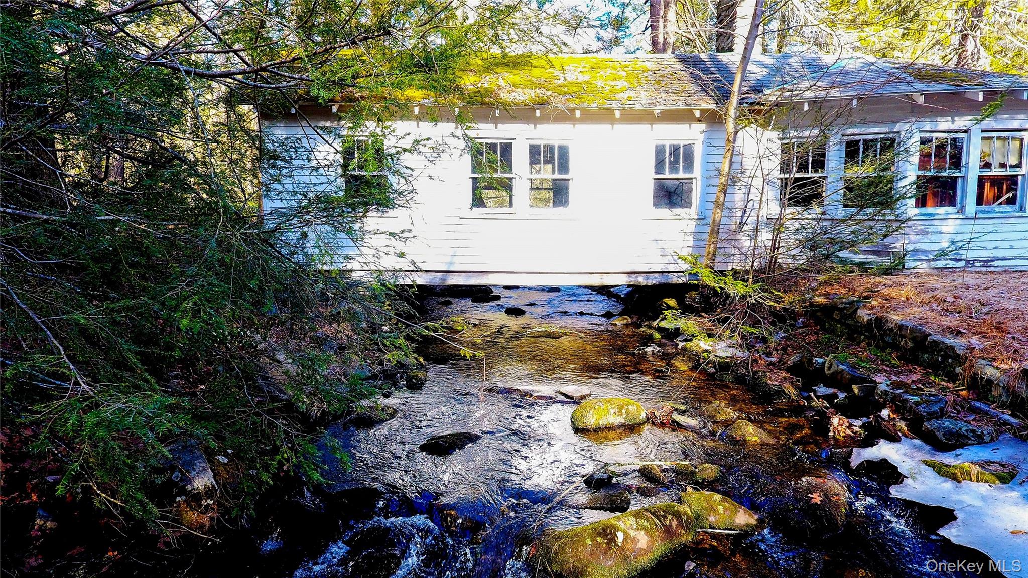 1021 Pine Kill Road Wurtsboro, NY 12790 - Photo 2 of 37 View of side of cottage which is built across the creek