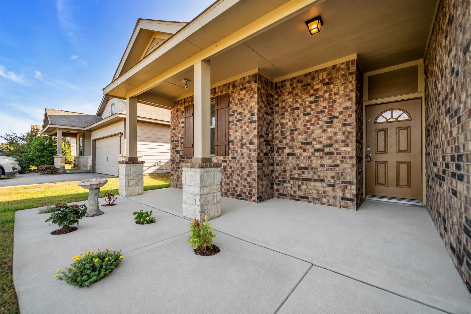 4707 Waukegan Road Conroe, TX 77306 - Photo 2 of 31 Enjoy the outdoors from the inviting front patio, a comfortable spot to unwind while taking in views of the surrounding neighborhood.