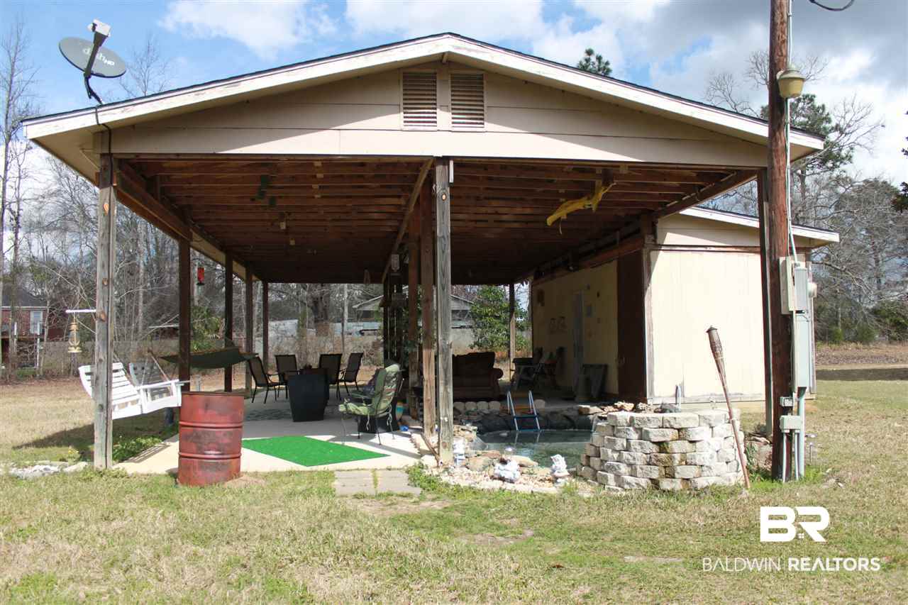 9380 Spice Pond Road Eight Mile, AL 36613 - Photo 10 of 36 Attached & enclosed 25x10 storage w/garage door