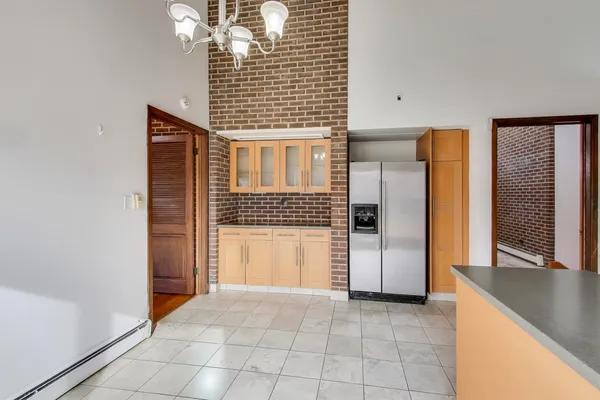 a kitchen with stainless steel appliances granite countertop a sink and cabinets