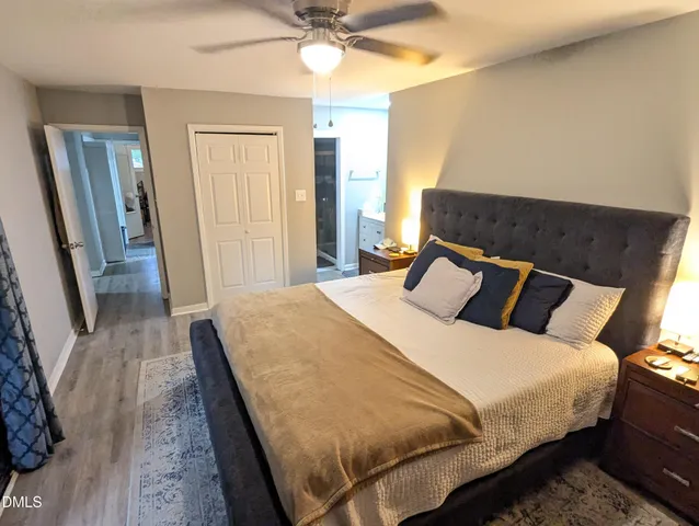 a bedroom with bed and window