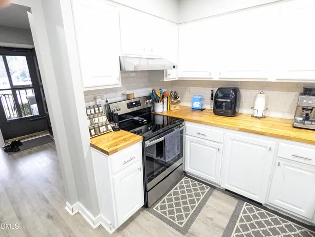 a kitchen with a stove and a sink