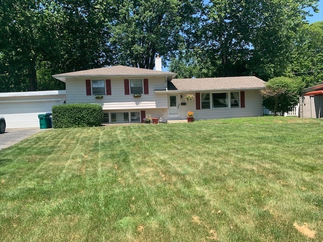 a house view with a garden space