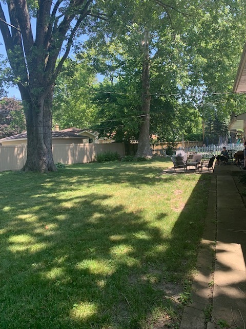 339 Redbud Drive Naperville, IL 60540 - Photo 2 of 2 a view of a swimming pool with a bench in a patio
