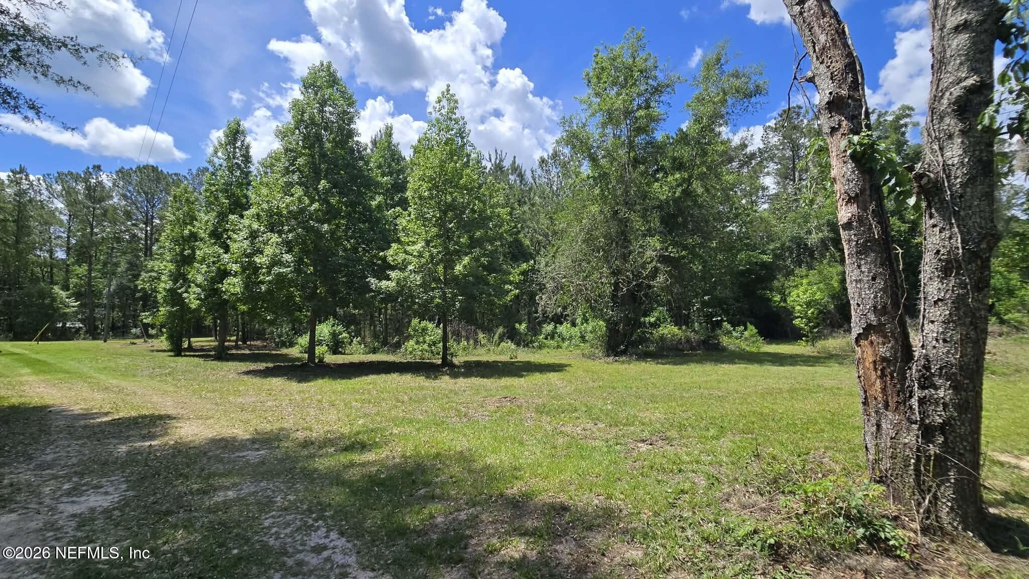 3923 Skipper Road Middleburg, FL 32068 - Photo 17 of 25 a view of outdoor space with deck and yard