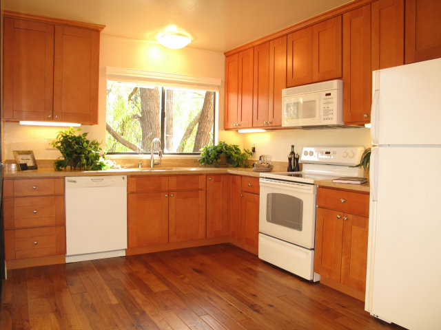 2040 West Middlefield Road, Unit 2 Mountain View, CA 94043 - Photo 2 of 4 a kitchen with a sink cabinets wooden floor and a window