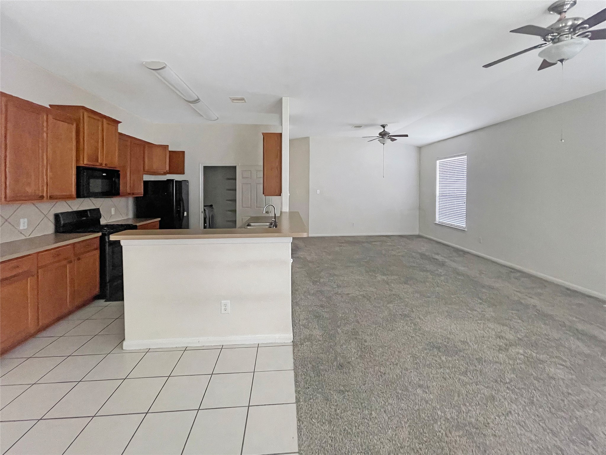 21314 Bella Flora Court Spring, TX 77379 - Photo 5 of 19 Kitchen and Living