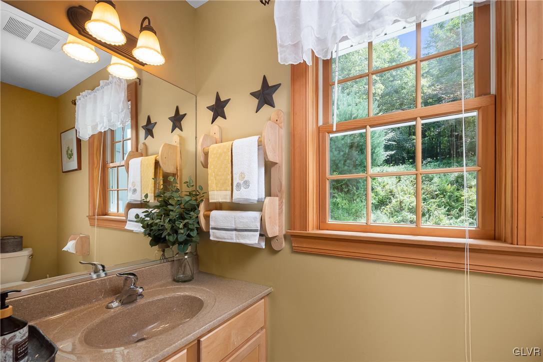 2413 Point Phillips Road Kunkletown, PA 18058 - Photo 22 of 48 a bathroom with a sink and a large mirror