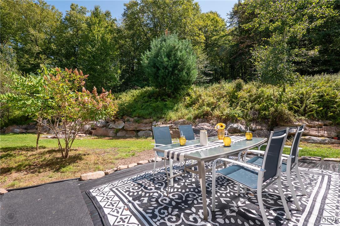 2413 Point Phillips Road Kunkletown, PA 18058 - Photo 34 of 48 a view of a chairs and table in backyard
