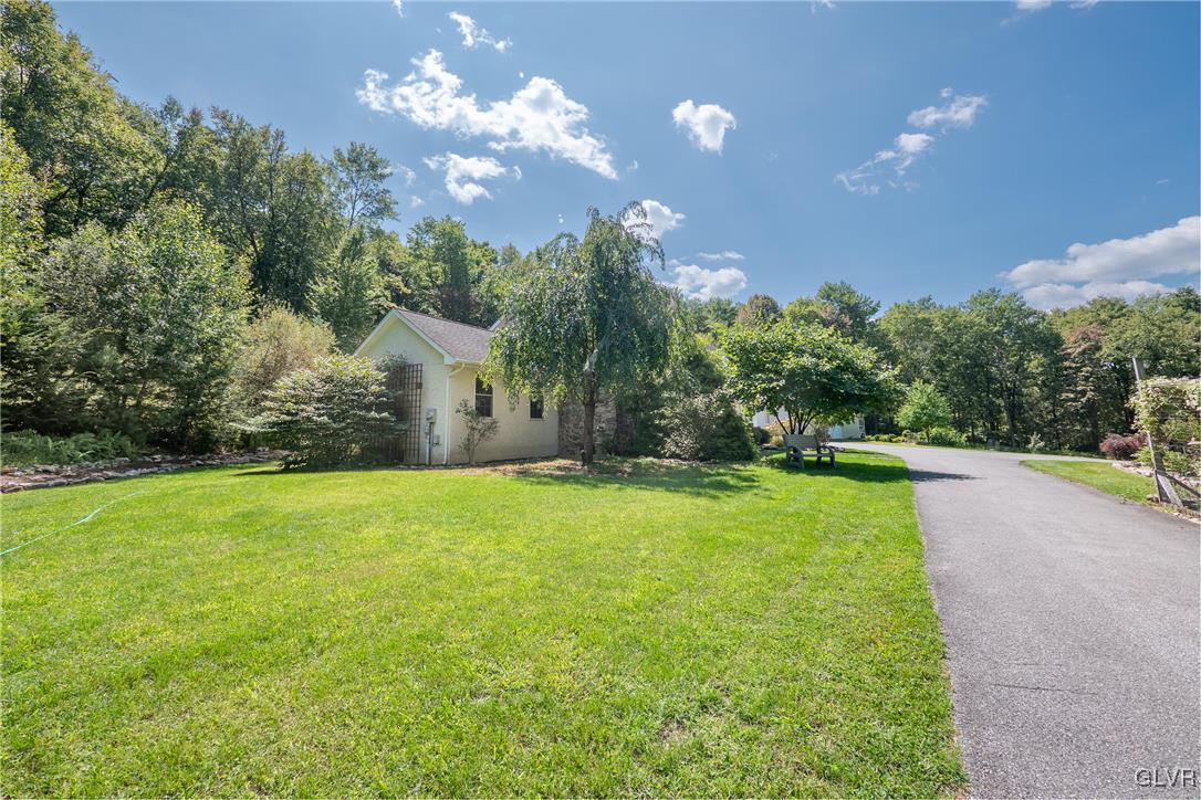 2413 Point Phillips Road Kunkletown, PA 18058 - Photo 10 of 48 a view of a house with a yard and basketball court