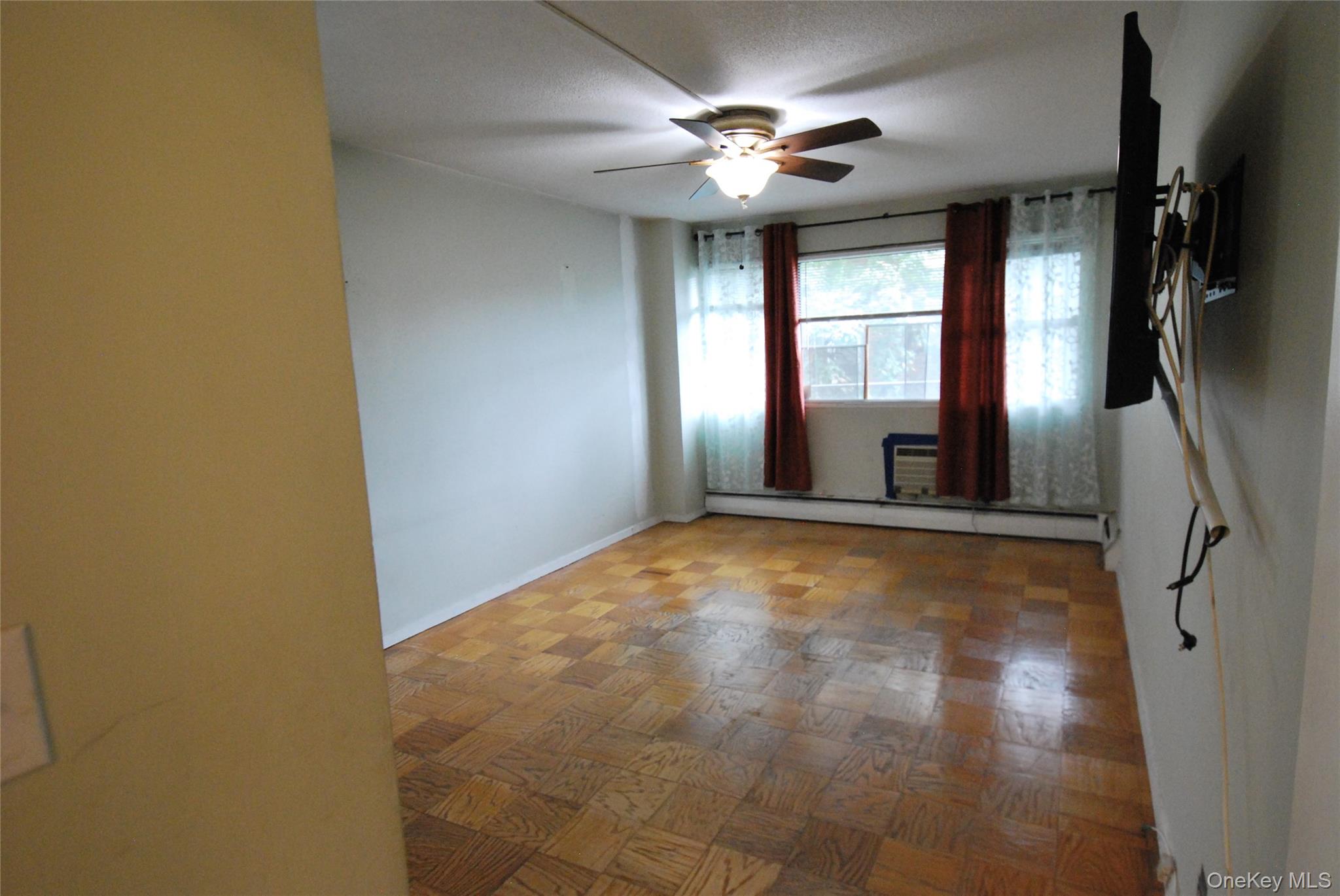 1523 Central Park Avenue, Unit 5F Yonkers, NY 10710 - Photo 11 of 20 a view of an empty room with a window