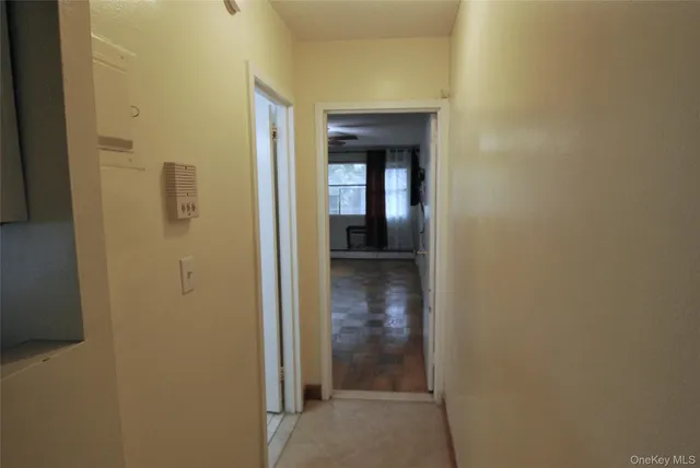 a view of a bathroom from a hallway