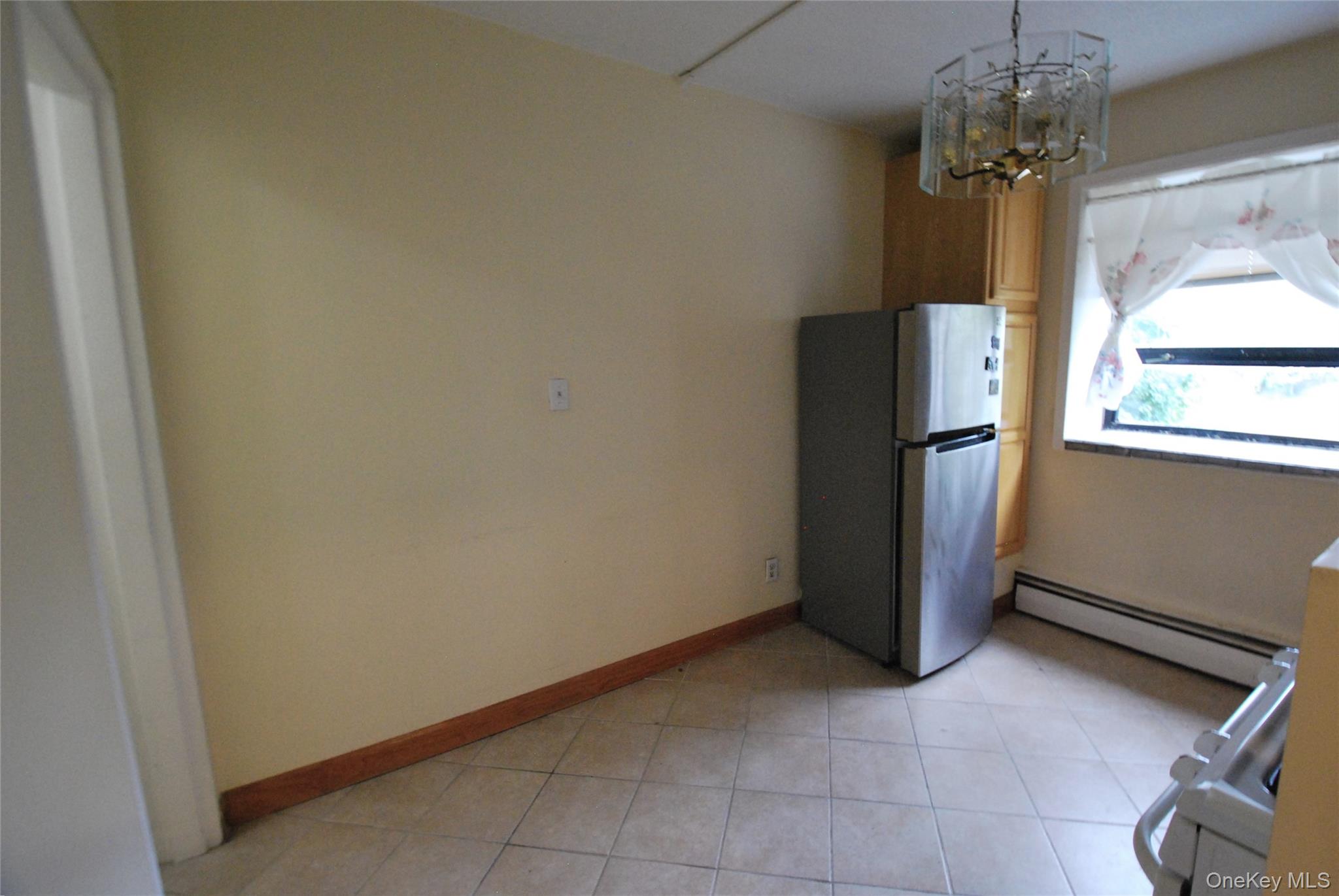 1523 Central Park Avenue, Unit 5F Yonkers, NY 10710 - Photo 4 of 20 a view of entryway with chandelier